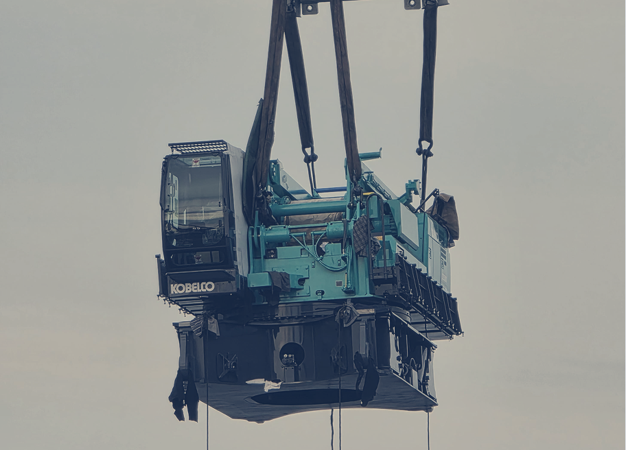 Kobelco machinery lifted securely, reflecting commitment to safe and careful handling
